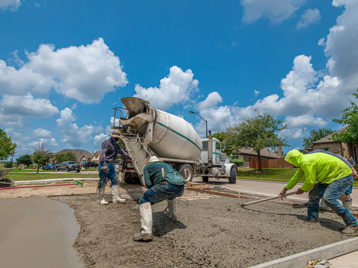 Driveway crew finishing a concrete pour in Montgomery County